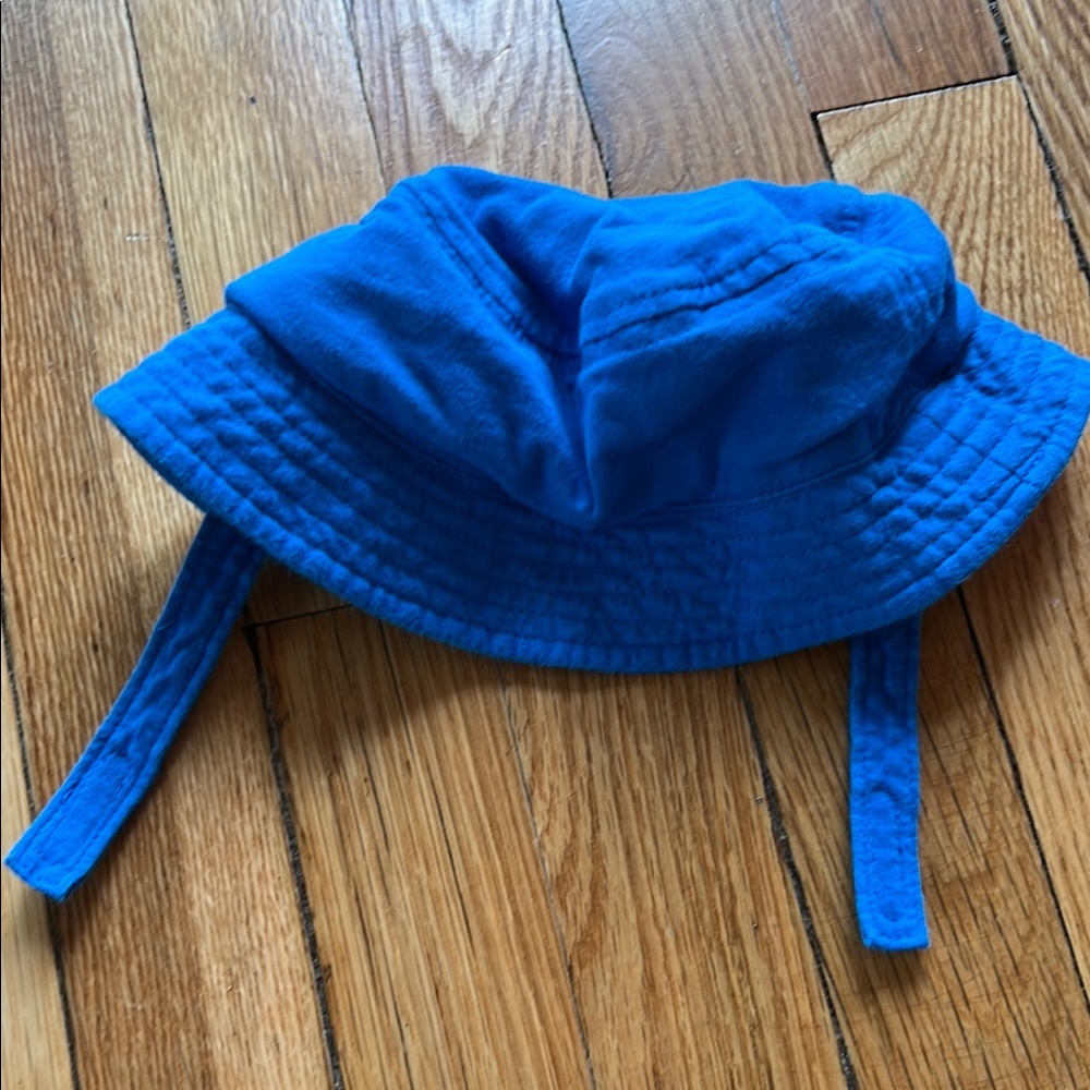3 for $9 
Great condition blue bucket hat with chin strap, size 6-12M